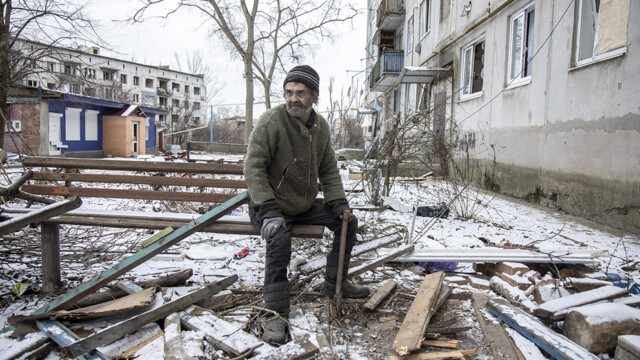 OCHERETYNE, DONETSK OBLAST, UKRAINE, FEBRUARY 19: A local civilian chops wood for making fire in the downtown of Ocheretyne, a village under heavy shelling in the vicinity of Avdiivka district, recently claimed by Russian troops in Donbas, Ukraine, February 19th, 2024.